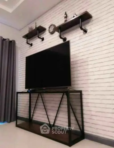 Modern living room with sleek TV stand and stylish wall shelves