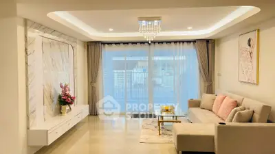 Elegant living room with modern decor and large window view