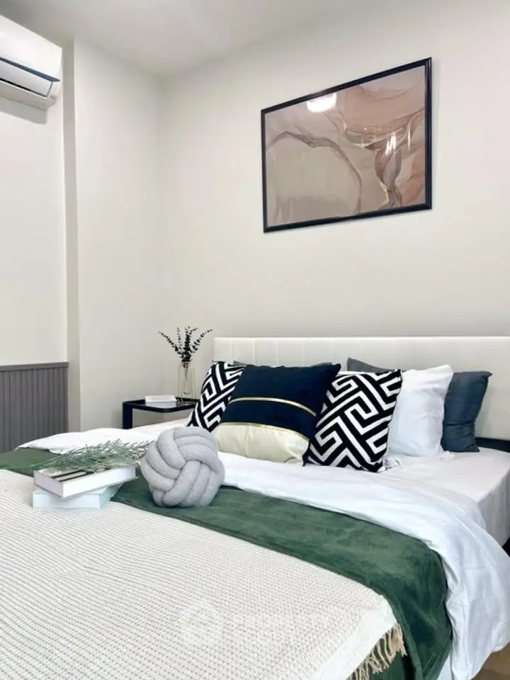 Stylish bedroom with modern decor and cozy bedding