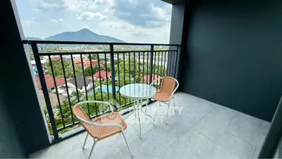 Spacious balcony with stunning mountain view, perfect for relaxation and enjoying the outdoors.