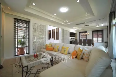 Luxurious open-plan living room with elegant decor and spacious seating area