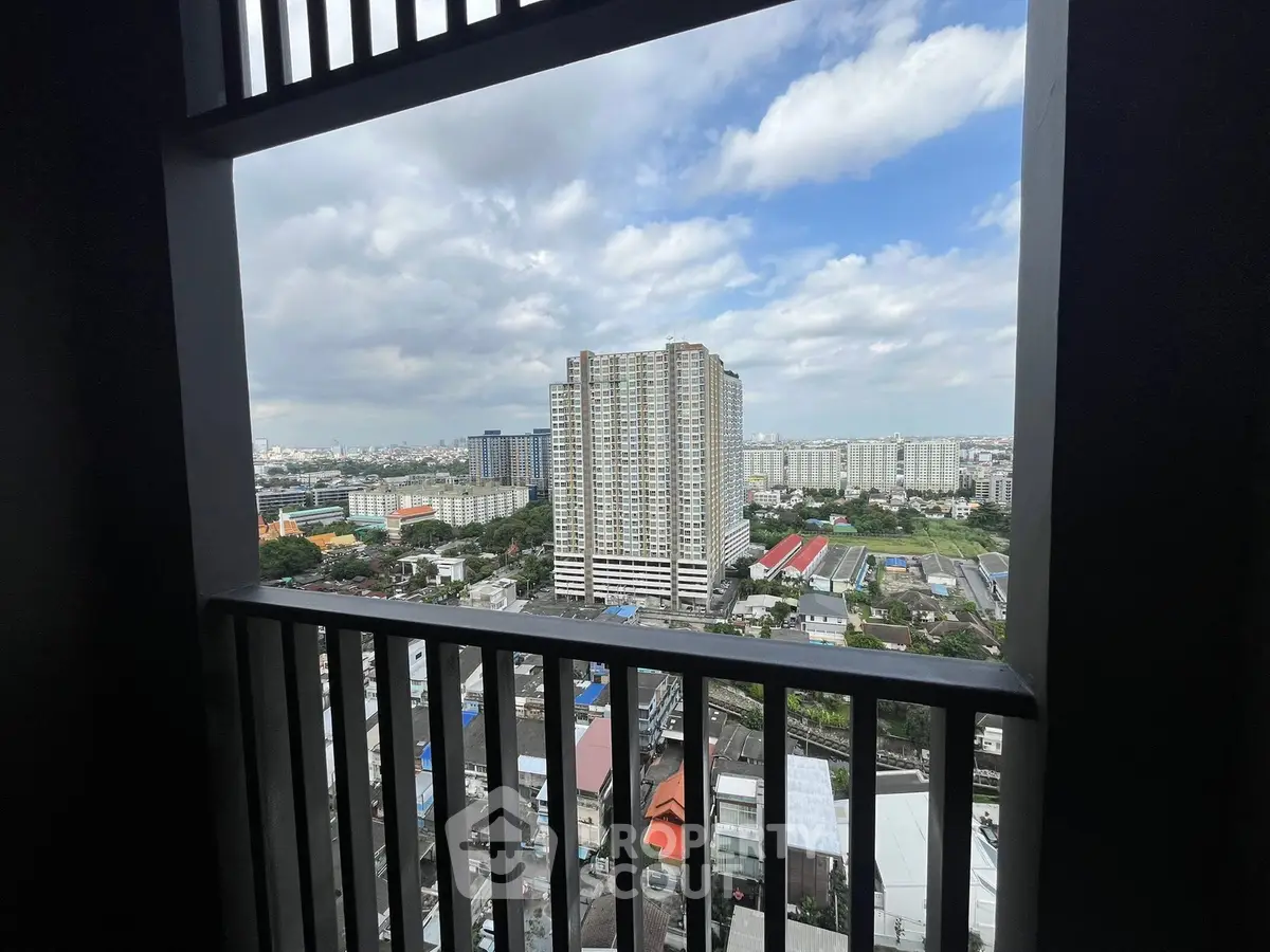Stunning cityscape view from high-rise balcony with expansive skyline.