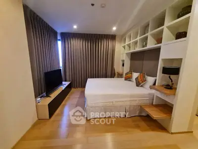 Spacious bedroom with modern decor and built-in shelving