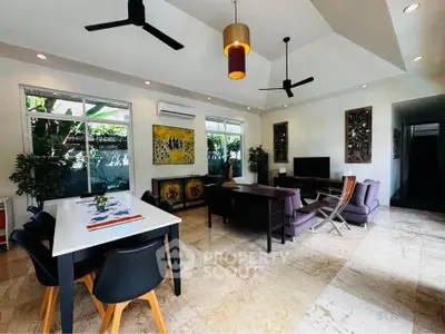 Spacious modern living room with elegant decor and ample natural light