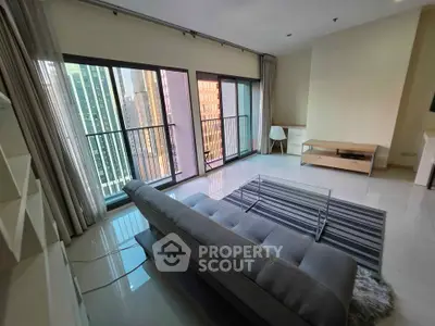 Modern living room with floor-to-ceiling windows and city view
