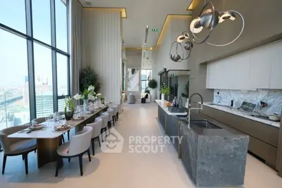 Luxurious open-layout kitchen with stunning city view and modern dining area