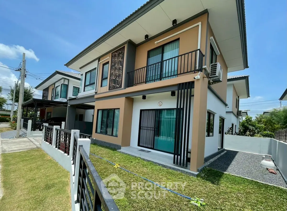 Modern two-story house with landscaped front yard and stylish facade