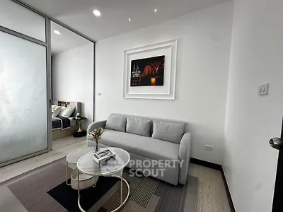 Modern living room with stylish decor and cozy sofa in a contemporary apartment.
