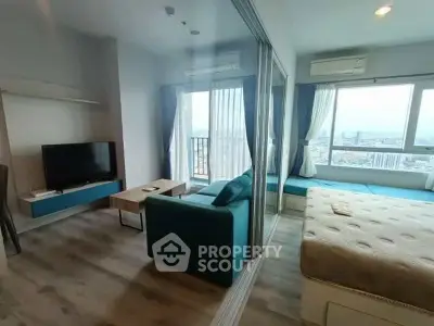 Modern studio apartment with large windows and city view