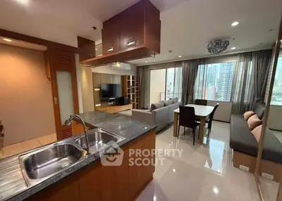 Spacious modern living room with open kitchen and city view