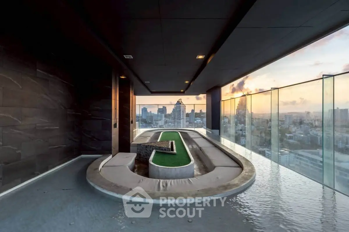 Luxurious rooftop with stunning city view and modern design, featuring a unique water feature and seating area.