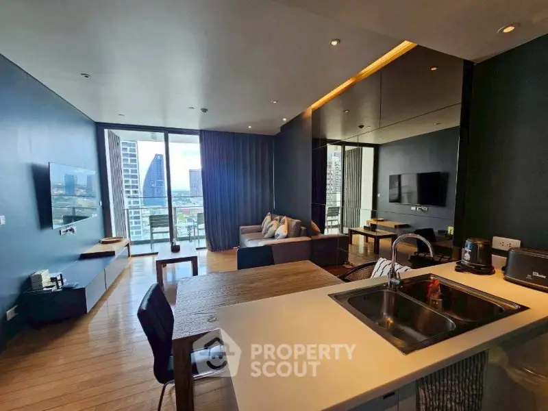 Modern open-plan living room with city view and sleek kitchen design