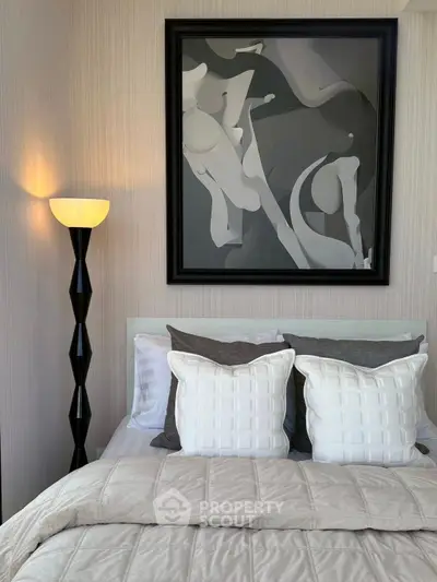 Stylish bedroom with modern decor and elegant floor lamp