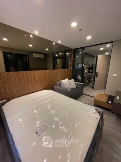 Modern bedroom with stylish decor and cozy seating area