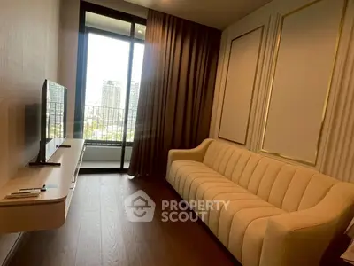 Modern living room with elegant sofa and large window offering city view