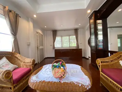 Charming living room with wicker furniture and bright natural light