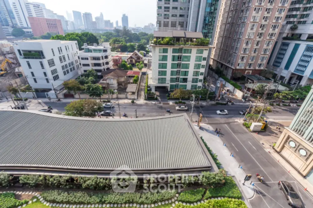 Stunning cityscape view from high-rise building showcasing urban living and modern architecture.