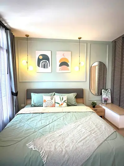 Stylish bedroom with modern decor, cozy bedding, and elegant lighting in a serene setting.