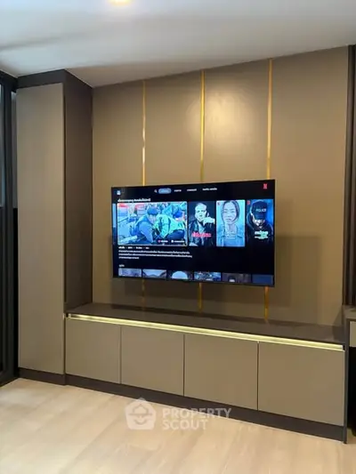 Modern living room with sleek TV setup and stylish cabinetry