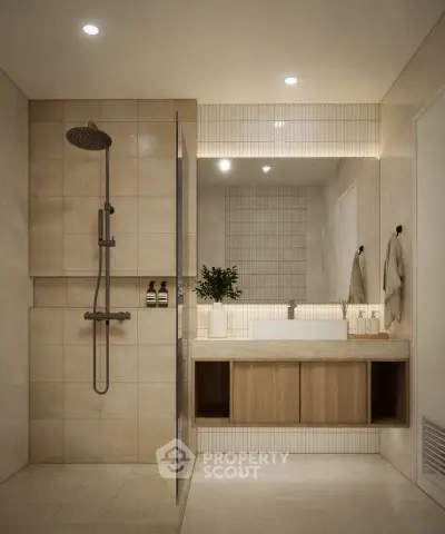 Modern bathroom with sleek fixtures and elegant lighting, featuring a spacious shower and stylish vanity.