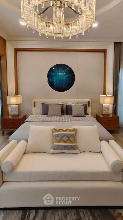 Luxurious bedroom with elegant chandelier and modern decor