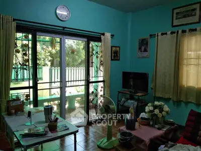 Cozy living room with sliding glass doors and garden view