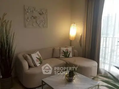 Cozy living room with modern sofa and elegant decor, perfect for relaxation.
