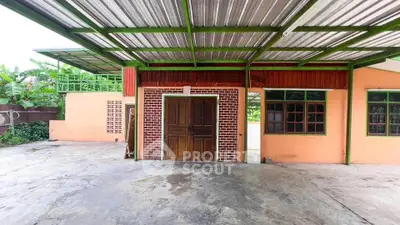 Charming rustic exterior with covered patio and brick accents, perfect for outdoor gatherings.