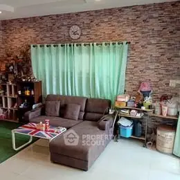Cozy living room with sectional sofa and stylish brick accent wall.