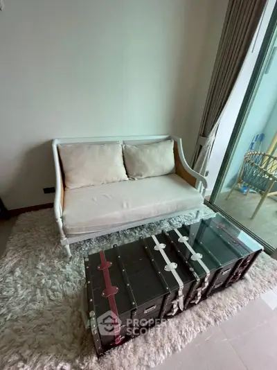 Cozy living room with elegant sofa and unique trunk-style coffee table