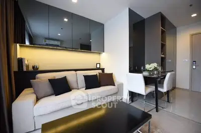 Modern living room with sleek design and dining area in a stylish apartment.