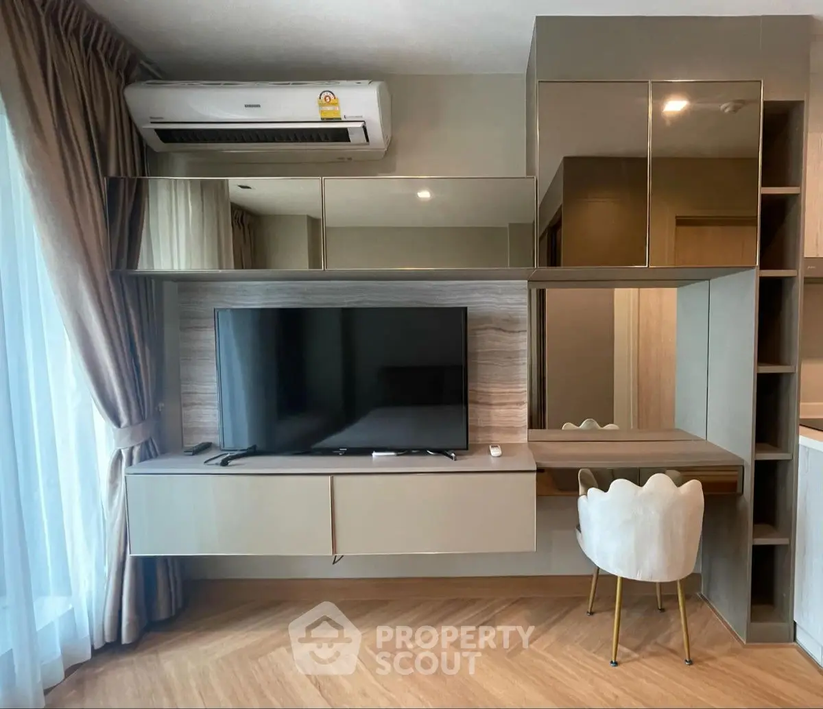 Modern living room with sleek TV setup and stylish furniture