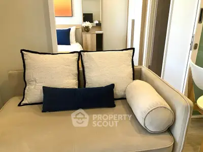 Modern living room with stylish sofa and elegant decor in a cozy apartment setting.