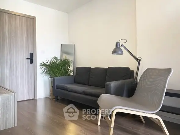 Modern living room with sleek furniture and stylish decor, perfect for urban living.