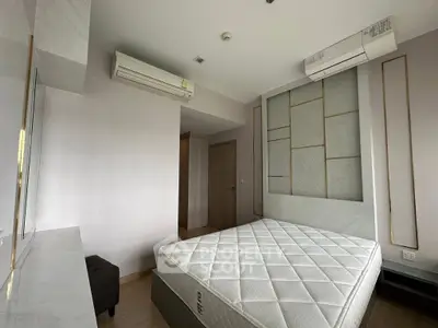 Modern bedroom with minimalist design and air conditioning unit