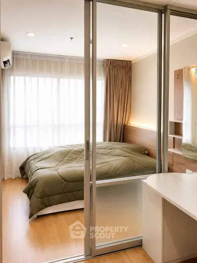 Modern bedroom with sliding glass doors and natural light