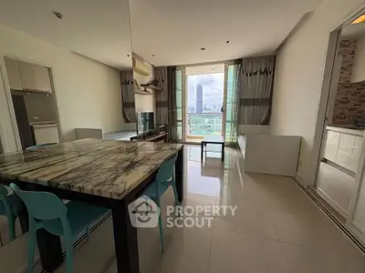 Spacious modern living room with city view and marble dining table