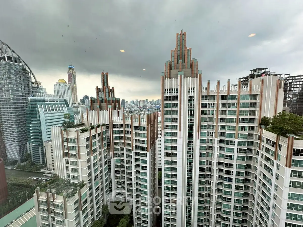 Stunning cityscape view from a high-rise apartment, showcasing modern architecture and urban skyline.