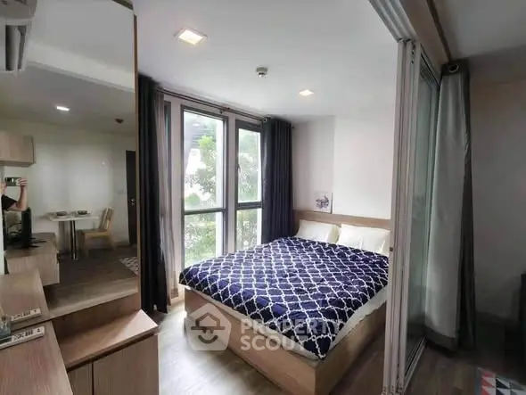 Modern bedroom with large windows and stylish decor in urban apartment