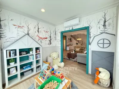 Charming family room with playful decor and open layout, perfect for kids and cozy gatherings.