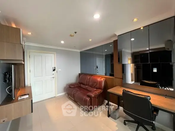 Modern living room with leather sofa and sleek mirrored wall design