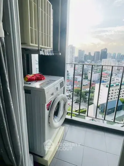 High-rise balcony with washing machine and stunning city view