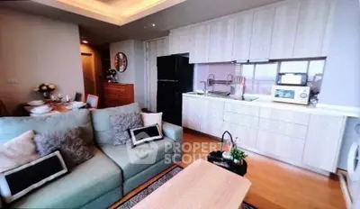 Modern open-layout kitchen and living room with stylish decor and appliances