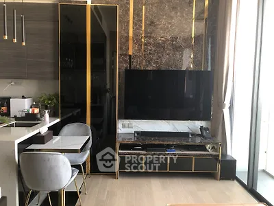 Luxurious modern living room with elegant decor and large TV setup