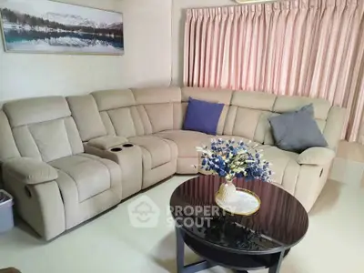 Cozy living room with plush beige sectional sofa and elegant decor