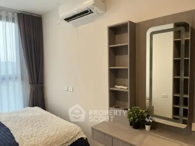 Modern bedroom with stylish decor and air conditioning in a cozy apartment