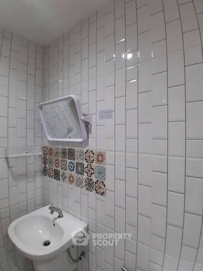Charming bathroom with stylish tile design and modern fixtures