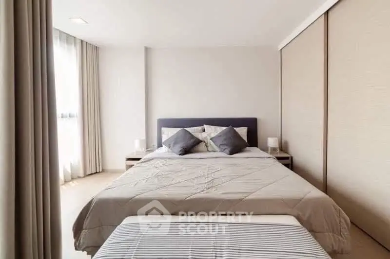 Modern bedroom with cozy bedding and natural light