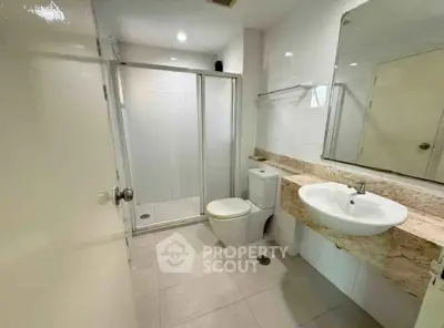 Modern bathroom with glass shower and sleek fixtures