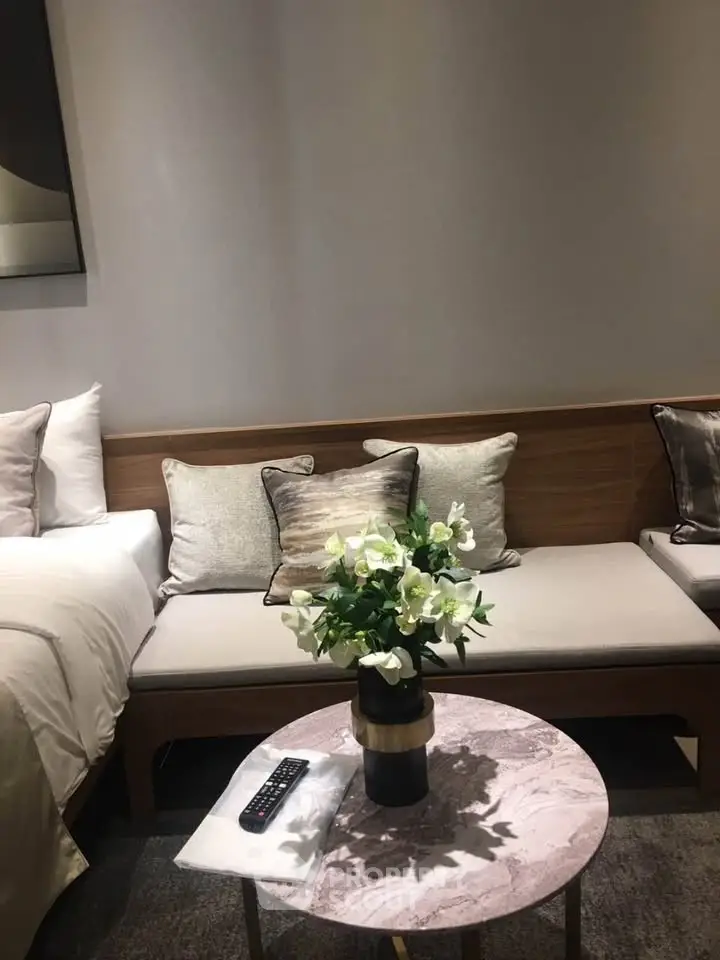 Elegant living room with cozy seating and stylish decor, perfect for relaxation and comfort.